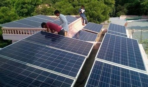 Solar panels installed on a house roof in Sikar, Rajasthan, showcasing renewable energy solutions in a residential setting.